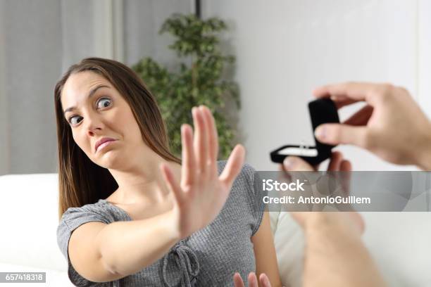 Girlfriend Rejecting A Marriage Proposal Stock Photo - Download Image Now - Engagement, Wedding, Humor