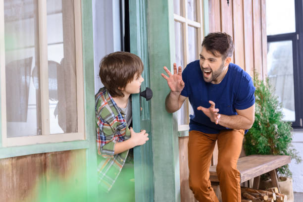 istock side view of grimace father found son while playing hide and seek at home 657421330