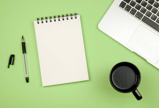 istock Top view flat lay picture with blank notepad page and different accessories on colored surface 657424778