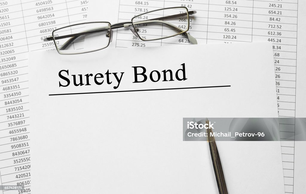 Paper with Surety Bond on a table Bonding Stock Photo