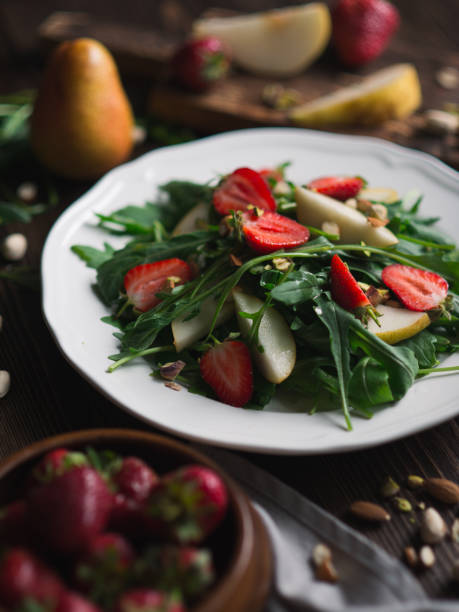 istock Salad with strawberry, arugula, pear 657432362