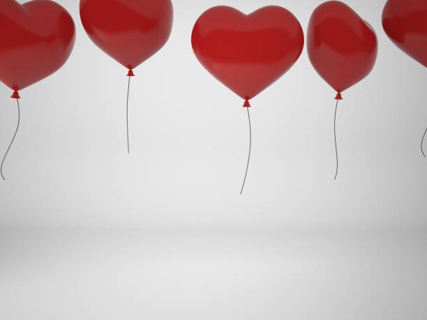 istock 3D rendering  red balloons in form of heart isolated on white background, illustration 657432414