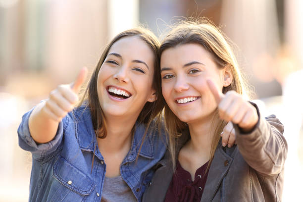 istock Two funny friends with thumbs up 657433126