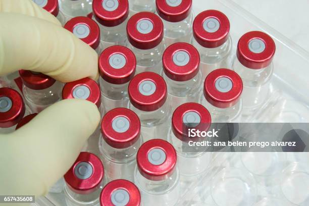 Hand Taking A Medicine Bottle In The Laboratory Stock Photo - Download Image Now - Healthcare And Medicine, Healthcare Worker, Horizontal