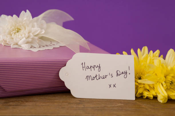 istock Happy mothers day card on gift box with flowers 657435996