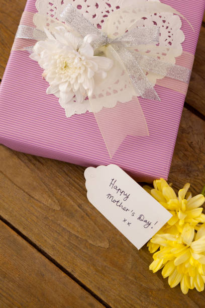 istock Happy mothers day card on gift box with flowers 657436006