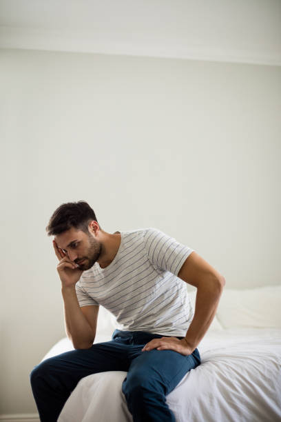 istock Worried man sitting in the bedroom 657439232
