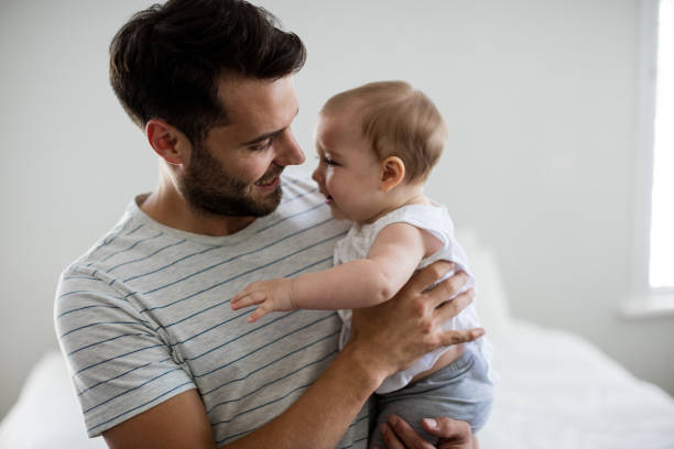 istock Father holding his baby girl 657439294
