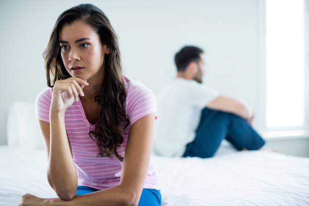 istock Couple ignoring each other in bedroom 657441856