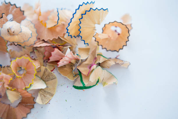 istock Colored pencils shavings on a white background 657445626