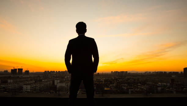 istock Businessman waiting sunrise 657452144