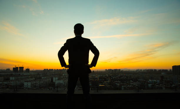 istock Businessman waiting sunrise 657452150