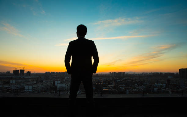 istock Businessman waiting sunrise 657452166