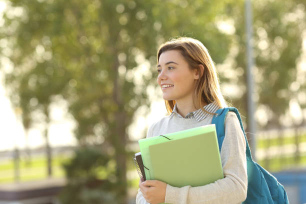 istock Student girl walking outdoors 657452496
