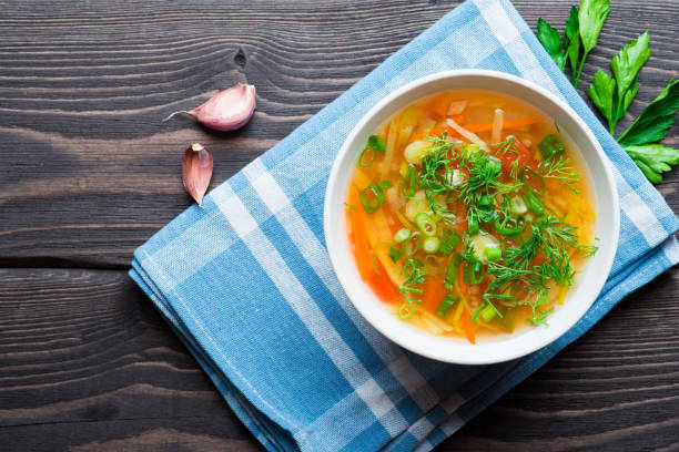 Vegetable soup with carrot Vegetable soup with carrot, tomatoes, turnip and leek vegetable soup stock pictures, royalty-free photos & images