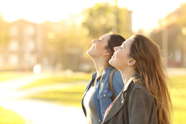 istock Two girls breathing fresh air in a park 657459962