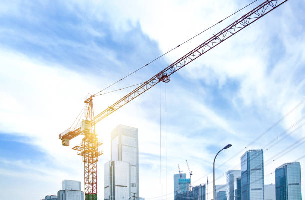 istock buildings construction tower crane site over city 657460392