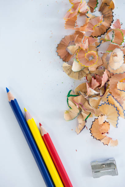 istock Colored shavings with colored pencils and sharpener on white background 657461158
