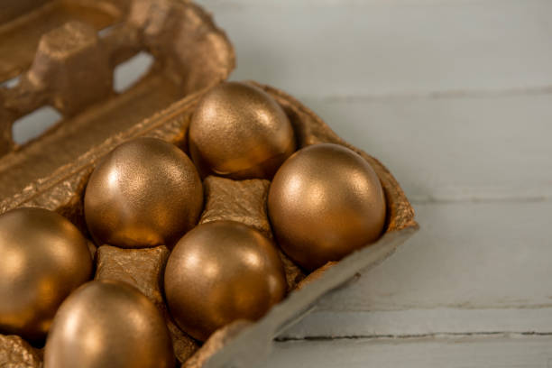 istock Close-up of golden Easter eggs in the carton 657463962