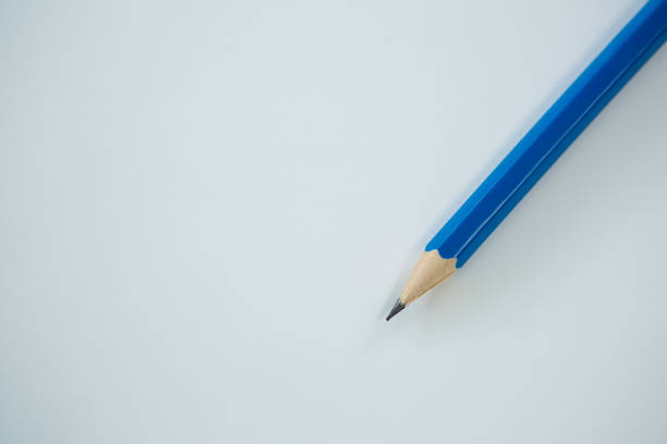 Close-up of blue color pencils on white background