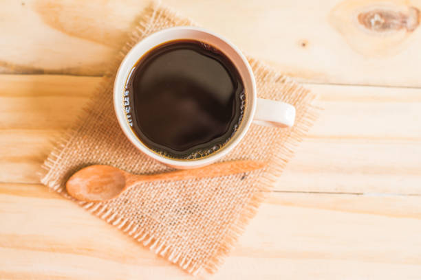 istock coffee cup on wooden background 657464786