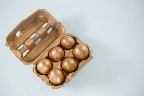 istock Close-up of golden Easter eggs in the carton 657465270