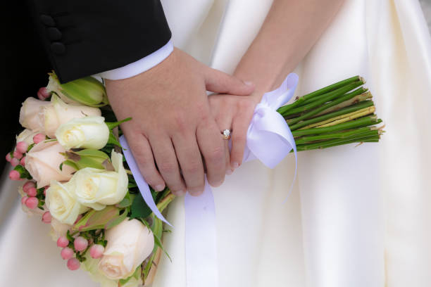 istock bride and groom hand in hand 657469208