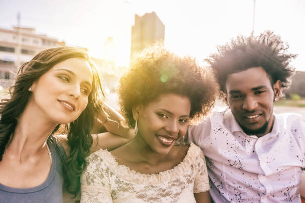 istock group of three young cuban people in open car in Havanna 657474854