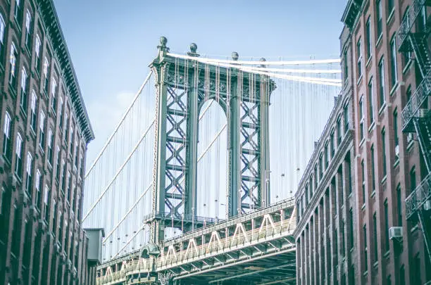 When you look down Washington street in DUMB O you will see the world famous Manhattan Bridge which connects the island of Manhattan with Brooklyn New York. DUMBO is considered to be hipster central and is home to Brooklyn Bridge Park which crosses under Manhattan bridge.