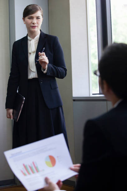 istock Businesswomen have a PC, stand 657478862