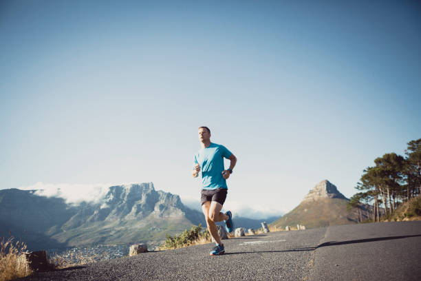 istock Strong male running along the road 657481414