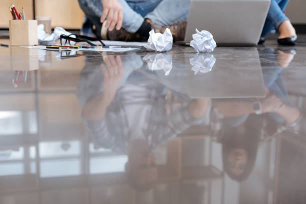 istock Crumpled paper balls lying on the floor 657484750