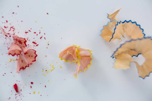 istock Colored pencils shavings on white background 657485110