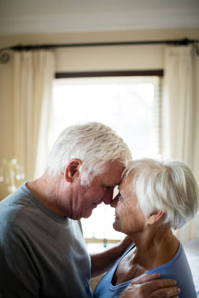 istock Senior couple romancing in bedroom 657488834