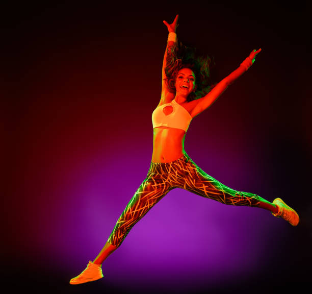one caucasian woman dancer dancing fitness exercises isolated on colorful background