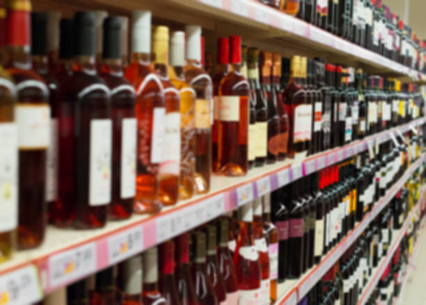istock Blurred image of shelves with alcoholic drinks in supermarket. 657499922