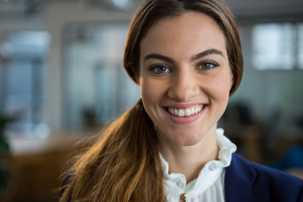 istock Smiling female executive standing in creative office 657500274