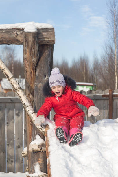 istock girl on a playground in winter 657500918