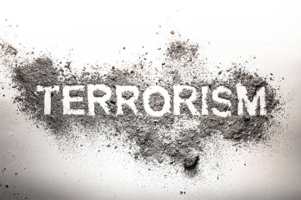 istock Terrorism word written in grey ash, dust, dirt as awful, dangerous, frightening, foreboding concept 657513916