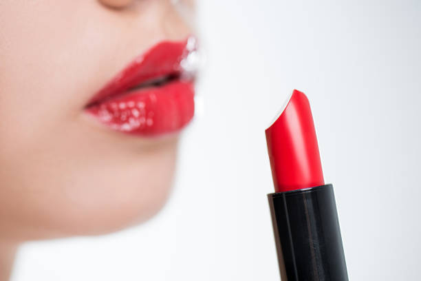 istock Woman holding red lipstick 657516688