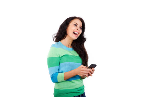istock Cheerful woman holding smart phone against white background 657521356