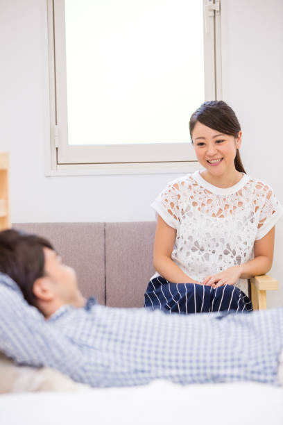 istock Women sit men into bed and sofa 657521458