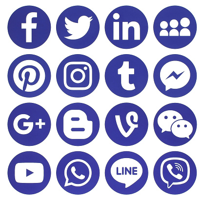 Kiev: Collection of popular blue round social media icons, printed on paper: Facebook, Twitter, Google Plus, Instagram, Pinterest, LinkedIn, Blogger, Tumblr and others