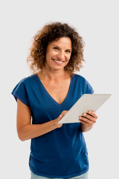 istock Happy woman working with a tablet 657525200
