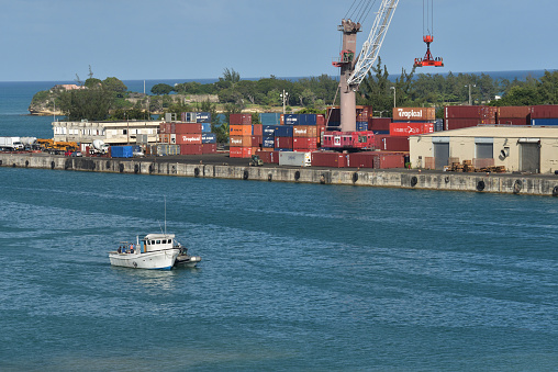 The industrial view of Tampa city port with different size ships and a crane (Florida).