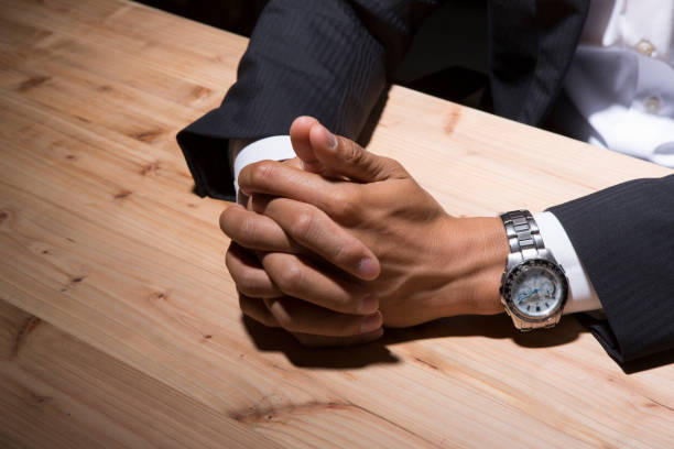 istock Businessmen join hands in the dark 657528186