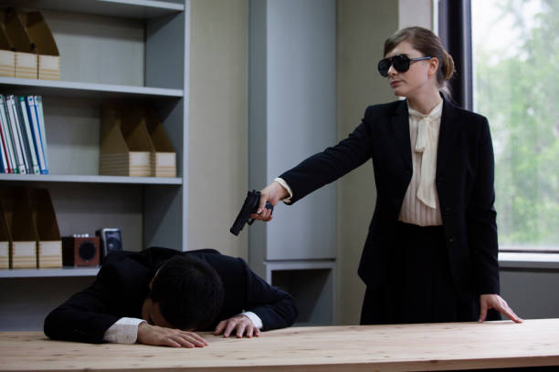 istock Female assassin in a suit 657532580