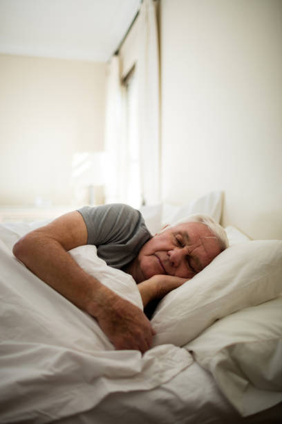 Senior man sleeping in the bedroom