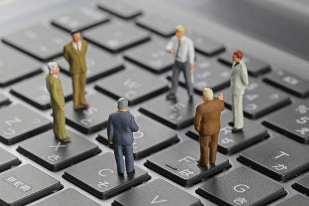 istock Businessman laptop keyboard and miniature 657532988