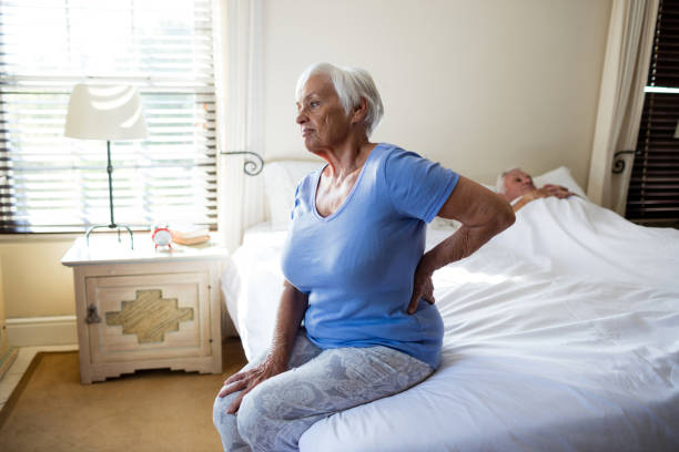 istock Senior woman suffering from backache in the bedroom 657533052